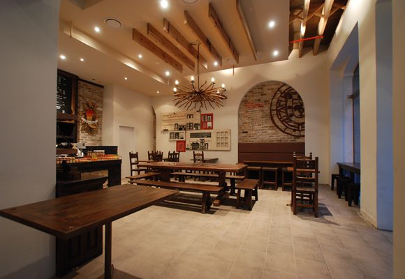 Nandos Kent St inside showing tables and benches for seating